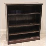 A late 19th century stained wood open front bookcase, the moulded top above three adjustable