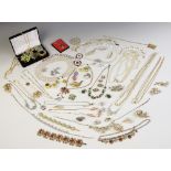 A large quantity of vintage costume jewellery and accessories, including paste set suites, gold