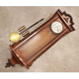 A Victorian Vienna twin weight wall clock, the walnut and ebonised case enclosing the 19cm white
