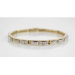 A diamond set 18ct gold line bracelet, designed as ten yellow gold rectangular links set with