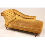 A Victorian chaise lounge/day bed, in foliate damask fabric, the padded and button back scroll end