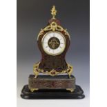 A late 19th century French boule work and ebonised mantel timepiece, of waisted form with applied
