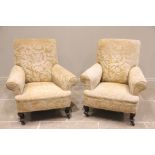 A near pair of Edwardian drawing room chairs, covered in foliate damask fabric, the padded