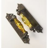 A pair of faceted amber glass door pull handles, 19th century, the glass handles set to ogee brass