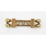 A Victorian Etruscan style gold coloured brooch, designed as two tubular bars with three rope