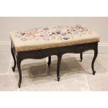 A Louis XV style walnut duet stool, late 19th/early 20th century, the hinged tapestry upholstered