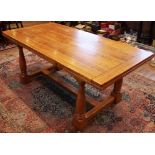 An oak draw leaf refectory table by Willis and Gambier, late 20th century, the cleated slab top with