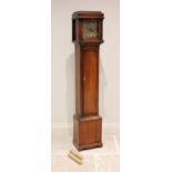 An early 20th century oak cased grandmother clock, the caddy top with freestanding ring turned