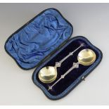 A cased pair of Victorian silver anointing spoons, Wakely & Wheeler, London 1898, each fig shaped