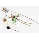 A selection of stick pins and accessories, to include a carved hardstone cameo stick pin,