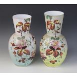 A near pair of Victorian painted opaline glass vases, each of ovoid form with tapered necks,