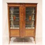 An Edwardian inlaid mahogany display cabinet, inlaid with swags, urns and garlands in satinwood, the