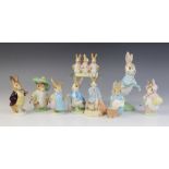 Nine Beswick Beatrix Potter rabbit figures, comprising: Peter Rabbit (first version: small size;