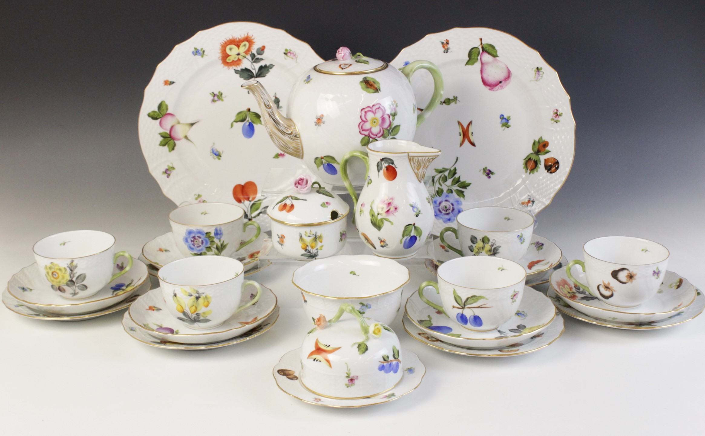 A Herend Hungary hand painted tea service, comprising: a teapot and cover, a milk jug, a sucrier and