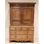 A 19th century and later honey oak Welsh linen press, the cavetto cornice above a plain mahogany