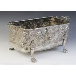 A late 19th silver coloured jardinière, of rectangular form with cast twin-handles, embossed