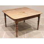 A 19th century oak kitchen table, possibly French, the rectangular plank top with rounded corners