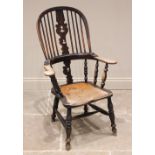 A 19th century elm, ash and alder Windsor farmhouse elbow chair, the hoop back with central