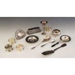 A selection of silver and silver coloured tableware and accessories, to include; a silver circular