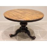 A mid 19th century rosewood centre table, the moulded circular top raised upon a carved bulbous