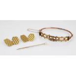 A Victorian gold coloured bangle, designed as two entwined hearts set with simulated pearls and
