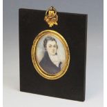 English school (early 19th century), A bust length oval portrait miniature depicting a young