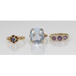 An early 20th century 18ct gold sapphire set floral ring, the central round mixed cut sapphire