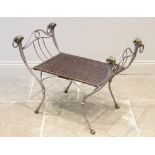 A Grecian style iron and wicker dressing stool, late 20th century, the four gilt metal rams mask and