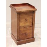 A Victorian mahogany bedside cupboard, the three quarter galleried top above a cupboard door and