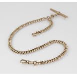A Victorian gold coloured watch chain, designed as a graduated curb link chain with lobster claw