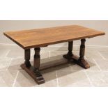 An elm refectory table, late 20th century, the rectangular slab top raised upon two pairs of