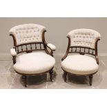 A pair of Victorian ladies and gents walnut tub chairs, each with a padded button back above a