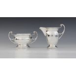 A George VI silver milk jug and sucrier, Charles S Green & Co Ltd, Birmingham 1938, each of plain