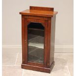 A Victorian walnut music cabinet, punctuated with inlaid satinwood and ebony octagons centred with