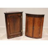 A George III oak straight front hanging corner cupboard, the single panelled opening to
