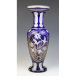 A Victorian bohemian blue glass vase, of inverted baluster form with trumpet neck on circular