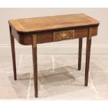 A George III mahogany and rosewood crosshanded folding tea table, the rectangular top with rounded