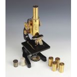 A black lacquer and brass microscope by Ernst Leitz Wetzlar, 20th century, serial number 290331,