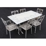 A Victorian style cast garden table and six chairs, 20th century, the table of rectangular form