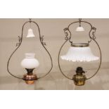 A Victorian brass hanging oil lamp, with a brass oil reservoir and crimped opaline glass shade