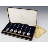 A set of six silver-gilt and enamel coffee spoons, Birmingham Mint, Birmingham 1978, each bowl