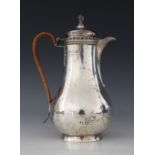 A George V silver hot water jug, John Henry Rawlings, London 1911, of baluster form on raised