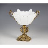A French gilt metal and glass comport, late 19th century, the rococo scroll base supporting an