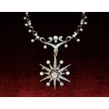 A Victorian diamond necklace, designed as a diamond set starburst brooch pendant, with central old