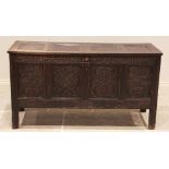 A James II carved oak coffer, the hinged four panel top above a frieze carved with 'Ann Harrison