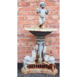 A cast iron garden feature/bird bath, 20th century, formed with a standing cherub figure within a