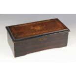 A Victorian rosewood music box, the inlaid cover opening to a inner hinged glazed door and 15cm