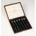 A cased set of Australian silver and enamel cocktail sticks, the finials designed as hearts,