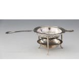 A George V silver tea strainer and stand, Henry Aitkin, Sheffield 1915-16, the strainer with pierced
