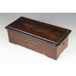 A late 19th/early 20th century Swiss eight aires rosewood music box, the front of the box applied